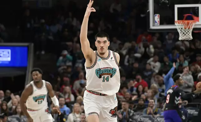 Memphis Grizzlies center Zach Edey (14) reacts in the first half of an NBA basketball game against the Toronto Raptors, Thursday, Dec. 26, 2024, in Memphis, Tenn. (AP Photo/Brandon Dill)