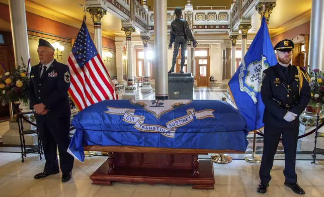 Former Gov. M. Jodi Rell lays in state at the Connecticut State Capitol before the public is allowed to pay their respect in Hartford, Conn., Tuesday, Dec. 3, 2024. (Aaron Flaum/Hartford Courant via AP)