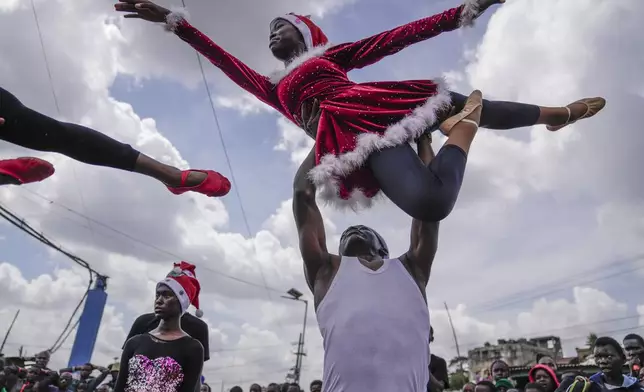 Young dancers perform, during a Christmas ballet event in Kibera slum, one of the busiest neighborhoods of Kenya's capital, Nairobi, Kenya Saturday, Dec. 21, 2024. (AP Photo/Brian Inganga)