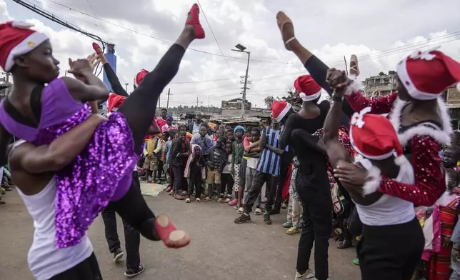 Young dancers perform, during a Christmas ballet event in Kibera slum, one of the busiest neighborhoods of Kenya's capital, Nairobi, Kenya Saturday, Dec. 21, 2024. (AP Photo/Brian Inganga)