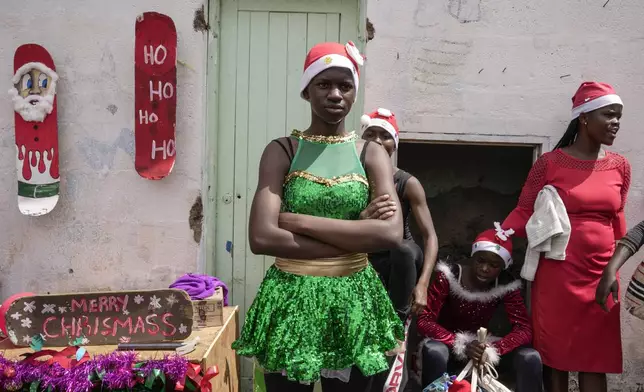 Young dancers watch a Christmas ballet event in Kibera slum, one of the busiest neighborhoods of Kenya's capital, Nairobi, Kenya Saturday, Dec. 21, 2024. (AP Photo/Brian Inganga)