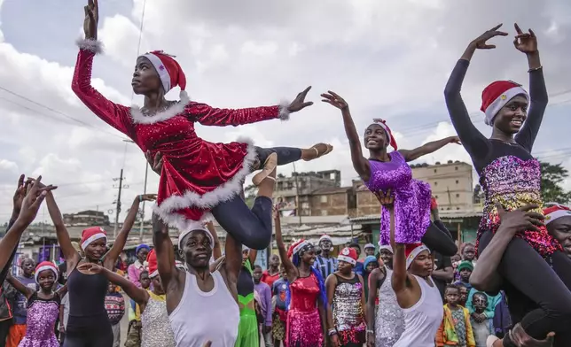 Young dancers perform, during a Christmas ballet event in Kibera slum, one of the busiest neighborhoods of Kenya's capital, Nairobi, Kenya Saturday, Dec. 21, 2024. (AP Photo/Brian Inganga)