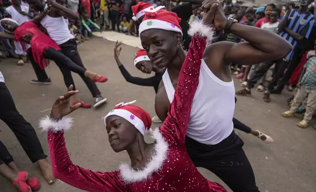 Young dancers perform, during a Christmas ballet event in Kibera slum, one of the busiest neighborhoods of Kenya's capital, Nairobi, Kenya Saturday, Dec. 21, 2024. (AP Photo/Brian Inganga)