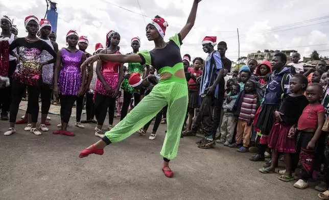 Young dancers perform, during a Christmas ballet event in Kibera slum, one of the busiest neighborhoods of Kenya's capital, Nairobi, Kenya Saturday, Dec. 21, 2024. (AP Photo/Brian Inganga)