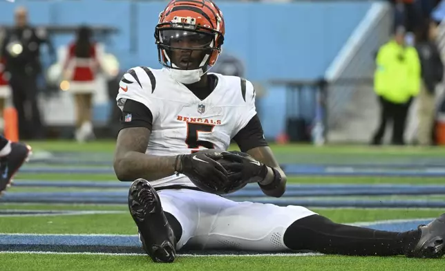 Cincinnati Bengals wide receiver Tee Higgins (5) reacts in the endzone after scoring a touchdown during the first half of an NFL football game against the Tennessee Titans, Sunday, Dec. 15, 2024, in Nashville, Tenn. (AP Photo/John Amis)