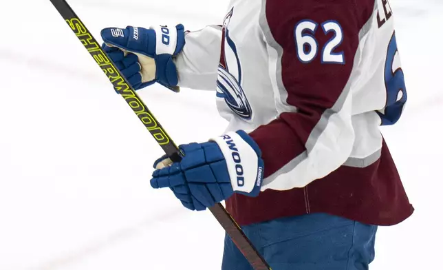 Colorado Avalanche left wing Artturi Lehkonen reacts after scoring a goal during the third period of an NHL hockey game against the Utah Hockey Club, Friday, Dec. 27, 2024, in Salt Lake City. (AP Photo/Rick Egan)