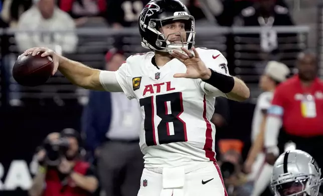 Atlanta Falcons quarterback Kirk Cousins (18) throws against the Las Vegas Raiders during the first half of an NFL football game, Monday, Dec. 16, 2024, in Las Vegas. (AP Photo/Rick Scuteri)