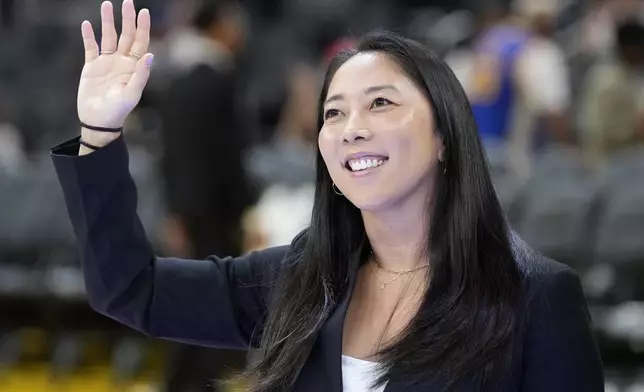 FILE - Golden State Valkyries WNBA head coach Natalie Nakase waves before an NBA preseason basketball game between the Golden State Warriors and the Sacramento Kings in San Francisco, Oct. 11, 2024. (AP Photo/Jeff Chiu, File)