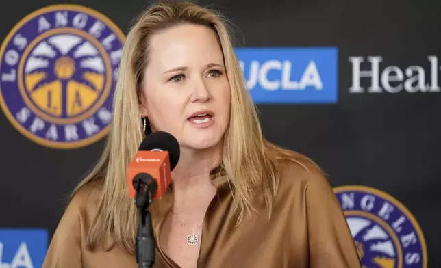 FILE - New Los Angeles Sparks head coach Lynne Roberts fields questions during a news conference for the WNBA basketball team Nov. 21, 2024, in Los Angeles. (AP Photo/Damian Dovarganes, File)