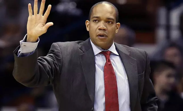 FILE - Fairfield head coach Sydney Johnson during the first half of an NCAA college basketball game against Louisville in the semifinal round of the Basketball Hall of Fame Tip-Off tournament at Mohegan Sun Arena in Uncasville, Conn., Nov. 23, 2013. (AP Photo/Michael Dwyer, File)