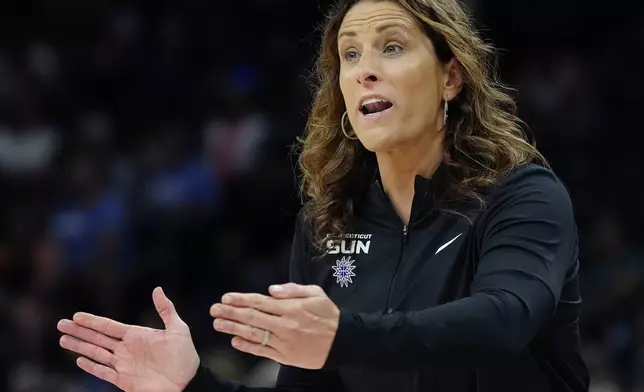 FILE - Connecticut Sun head coach Stephanie White shouts instructions to her players during the first half of a WNBA basketball game against the Phoenix Mercury, July 1, 2024, in Phoenix. (AP Photo/Ross D. Franklin, File)