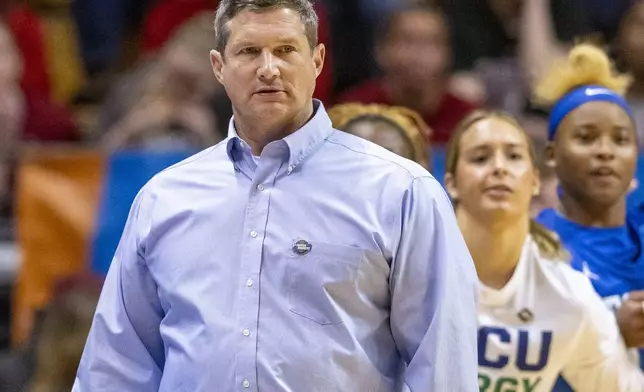 FILE - Florida Gulf Coast head coach Karl Smesko, left, watches play on the court during a first-round college basketball game against Oklahoma in the NCAA Tournament, March 23, 2024, in Bloomington, Ind. (AP Photo/Doug McSchooler, File)