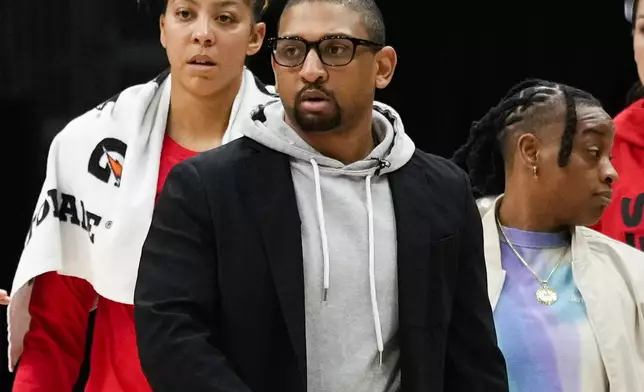 FILE - Las Vegas Aces interim head coach Tyler Marsh, center, looks on during a timeout in the second half of a WNBA basketball game against the Seattle Storm, May 20, 2023, in Seattle. (AP Photo/Lindsey Wasson, File)