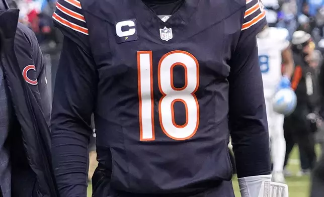 Chicago Bears quarterback Caleb Williams walks off the field after his team's 34-17 loss to the Detroit Lions in an NFL football game Sunday, Dec. 22, 2024, in Chicago. (AP Photo/Nam Y. Huh)