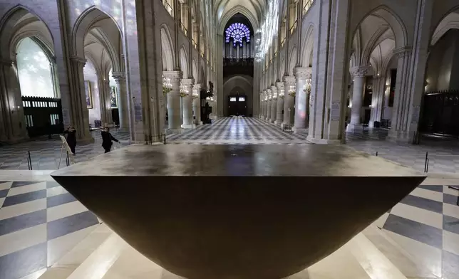 The altar designed by French artist and designer Guillaume Bardet is seen in the heart of Notre-Dame de Paris cathedral while French President Emmanuel Macron visits the restored interiors of the monument, Friday Nov. 29, 2024, in Paris. (Stephane de Sakutin, Pool via AP)