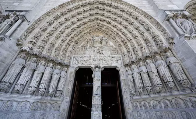 The main entrance of Notre-Dame de Paris cathedral is pictured after French President Emmanuel Macron visited the restored interiors of the monument, Friday Nov. 29, 2024, in Paris. (Stephane de Sakutin, Pool via AP)