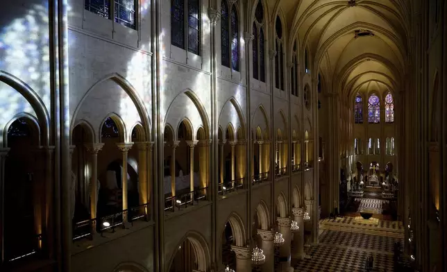 The nave of Notre-Dame de Paris cathedral is seen while French President Emmanuel Macron visits the restored interiors of the monument, Friday, Nov. 29, 2024 in Paris. (Sarah Meyssonnier/Pool via AP)