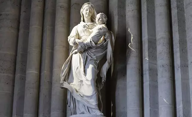 A statue is seen inside Notre-Dame de Paris cathedral while French President Emmanuel Macron visits the restored interiors of the monument, Friday Nov. 29, 2024, in Paris. (Stephane de Sakutin, Pool via AP)