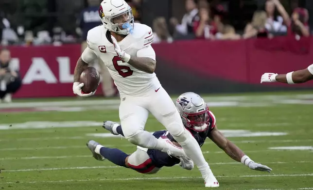 Arizona Cardinals running back James Conner (6) runs the ball against the New England Patriots during the first half of an NFL football game, Sunday, Dec. 15, 2024, in Glendale, Ariz. (AP Photo/Rick Scuteri)