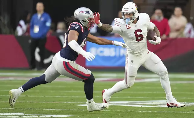 Arizona Cardinals running back James Conner (6) runs against the New England Patriots during the first half of an NFL football game, Sunday, Dec. 15, 2024, in Glendale, Ariz. (AP Photo/Ross D. Franklin)