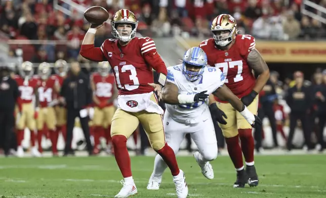 San Francisco 49ers quarterback Brock Purdy (13) runs for a touchdown during the first half of an NFL football game against the Detroit Lions, Monday, Dec. 30, 2024, in Santa Clara, Calif. (AP Photo/Jed Jacobsohn)