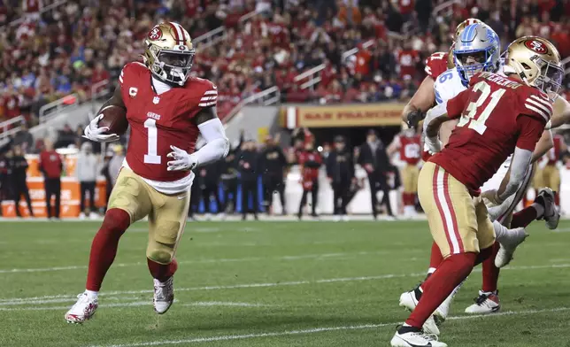 San Francisco 49ers wide receiver Deebo Samuel Sr. (1) scores a touchdown during the second half of an NFL football game against the Detroit Lions, Monday, Dec. 30, 2024, in Santa Clara, Calif. (AP Photo/Jed Jacobsohn)