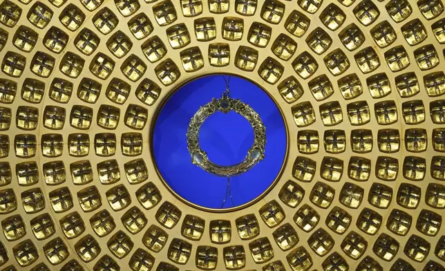 The ancient relic that many Christians revere as Jesus Christ's "Crown of Thorns" is seen in its reliquary as it returns to Notre Dame Cathedral, five years after it was saved from the flames of the cathedral's devastating 2019 fire, Friday, Dec. 13, 2024 in Paris. (AP Photo/Aurelien Morissard)