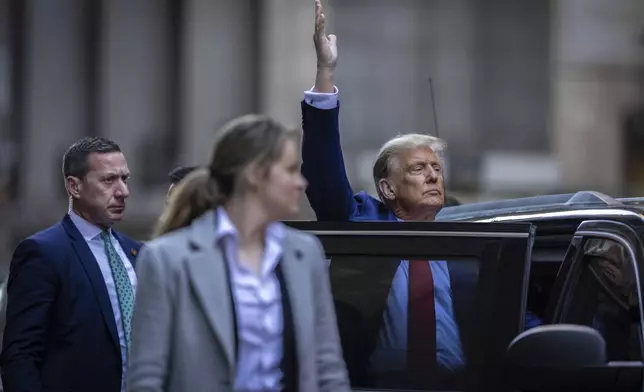 Former President Donald Trump leaves 40 Wall St. in downtown Manhattan, Thursday, Jan. 11, 2024, in New York. (AP Photo/Stefan Jeremiah)