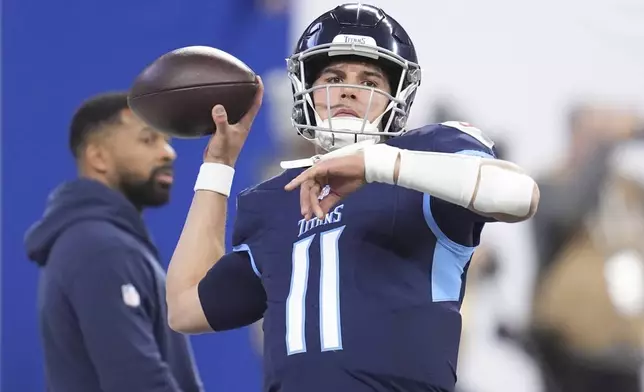 Tennessee Titans quarterback Mason Rudolph (11) warms up before an NFL football game against the Indianapolis Colts, Sunday, Dec. 22, 2024, in Indianapolis. (AP Photo/Michael Conroy)