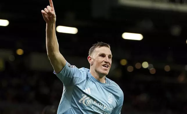 Nottingham Forest's Chris Wood celebrates scoring his side's third goal during the English Premier League soccer match between Manchester United and Nottingham Forest, at Old Trafford, Manchester, England, Saturday Dec. 7, 2024. (Martin Rickett/PA via AP)