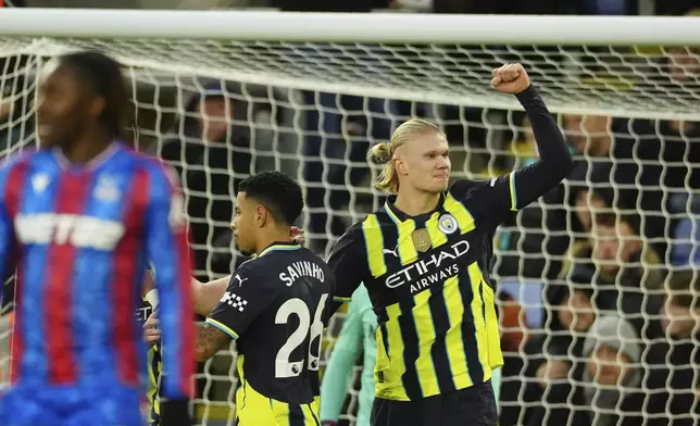 Manchester City's Erling Haaland celebrates scoring during the English Premier League soccer match between Crystal Palace and Manchester City at Selhurst Park in London, Saturday Dec. 7, 2024. (AP Photo/Dave Shopland)
