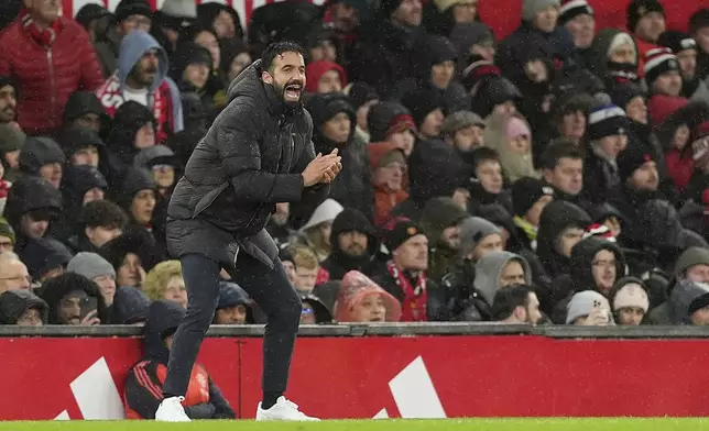 Manchester United manager Ruben Amorim gestures on the touchline during the English Premier League soccer match between Manchester United and Nottingham Forest, at Old Trafford, Manchester, England, Saturday Dec. 7, 2024. (Martin Rickett/PA via AP)