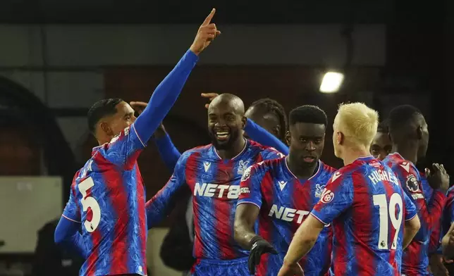 Crystal Palace's Maxence Lacroix, left, celebrates scoring with teammates during the English Premier League soccer match between Crystal Palace and Manchester City at Selhurst Park in London, Saturday Dec. 7, 2024. (AP Photo/Dave Shopland)