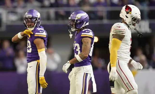 Minnesota Vikings wide receiver Justin Jefferson (18) reacts after catching a pass for a first down during the second half of an NFL football game against the Arizona Cardinals Sunday, Dec. 1, 2024, in Minneapolis. (AP Photo/Abbie Parr)