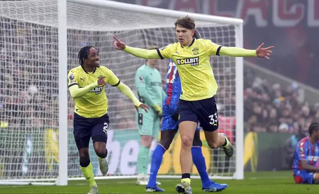 Southampton's Tyler Dibling, right, celebrates after scoring the opening goal during the English Premier League soccer match between Crystal Palace and Southampton at Selhurst Park, London, Sunday, Dec. 29, 2024. (Adam Davy/PA via AP)