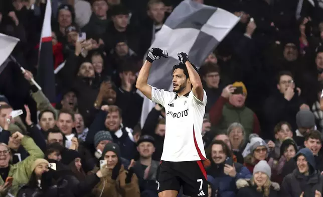 Fulham's Raul Jimenez celebrates scoring the opening goal during the English Premier League soccer match between FC Fulham and AFC Bournemouth, in London, Sunday, Dec. 29, 2024. (Steven Paston/PA via AP)