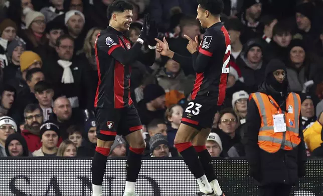 Bournemouth's Francisco Evanilson, left, celebrates after scoring his side's first goal during the English Premier League soccer match between FC Fulham and AFC Bournemouth, in London, Sunday, Dec. 29, 2024. (Steven Paston/PA via AP)