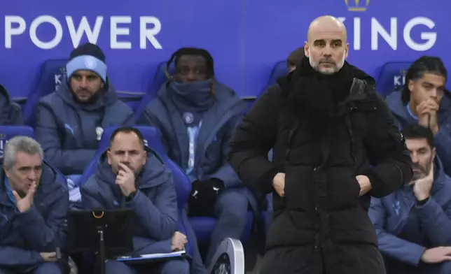 Manchester City's head coach Pep Guardiola reacts during the English Premier League soccer match between Leicester City and Manchester City at King Power stadium in Leicester, England, Sunday, Dec. 29, 2024. (AP Photo/Rui Vieira)