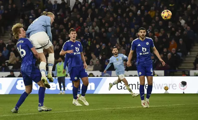 Manchester City's Erling Haaland, second left, scores his side's second goal during the English Premier League soccer match between Leicester City and Manchester City at King Power stadium in Leicester, England, Sunday, Dec. 29, 2024. (AP Photo/Rui Vieira)