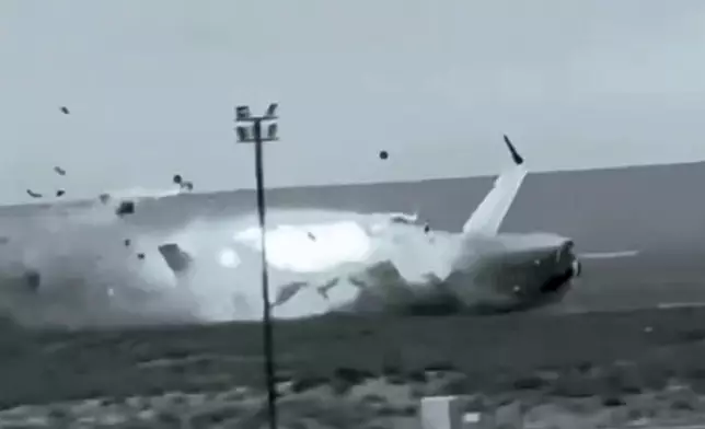 This image from video released by Kazakhstan Emergency Ministry Press Service on Friday, Dec. 27, 2024, shows the crash landing of the Azerbaijan Airlines' Embraer 190 on the ground near the airport of Aktau, Kazakhstan, on Thursday, Dec. 26, 2024. (Kazakhstan Emergency Ministry Press Service via AP)