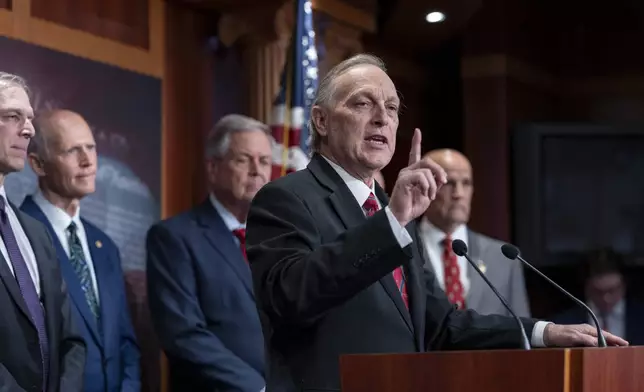 Rep. Andy Biggs, R-Ariz., joins a group of conservative Republicans to talk about the interim spending bill being crafted to avoid a shutdown of federal agencies, at the Capitol in Washington, Wednesday, Dec. 18, 2024. (AP Photo/J. Scott Applewhite)