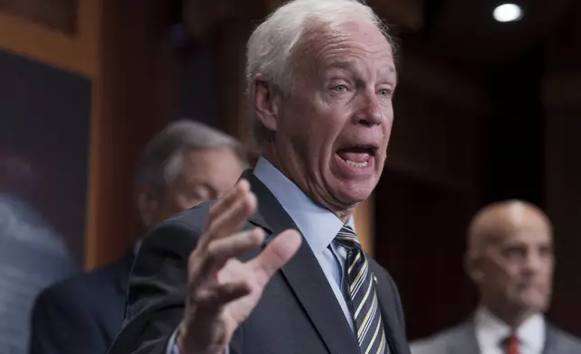 Sen. Ron Johnson, R-Wis., joins a group of conservative Republicans to talk about how Speaker of the House Mike Johnson moved to get an interim spending bill to avoid a government shutdown, during a news conference at the Capitol in Washington, Wednesday, Dec. 18, 2024. (AP Photo/J. Scott Applewhite)