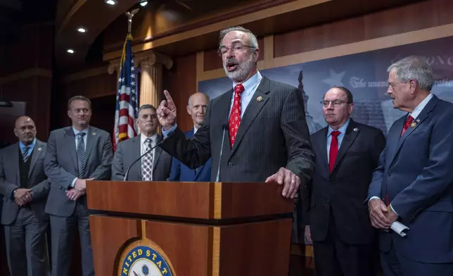 Rep. Andy Harris, R-Md., chairman of the House Freedom Caucus, joins a group of conservative Republicans to complain to reporters about the interim spending bill being crafted to avoid a shutdown of federal agencies, at the Capitol in Washington, Wednesday, Dec. 18, 2024. (AP Photo/J. Scott Applewhite)