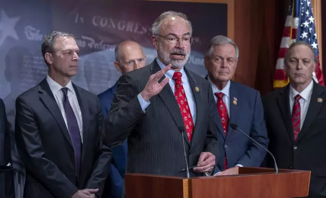 Rep. Andy Harris, R-Md., chairman of the House Freedom Caucus, joins a group of conservative Republicans to speak about the interim spending bill being crafted to avoid a shutdown of federal agencies, at the Capitol in Washington, Wednesday, Dec. 18, 2024. (AP Photo/J. Scott Applewhite)