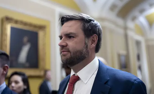 Sen. JD Vance, R-Ohio, the vice president-elect, leaves the Senate chamber as lawmakers work on an interim spending bill to avoid a shutdown of federal agencies, at the Capitol in Washington, Wednesday, Dec. 18, 2024. (AP Photo/J. Scott Applewhite)