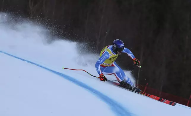 France's Cyprien Sarrazin speeds down the course during an alpine ski, men's World Cup downhill training, in Bormio, Italy, Friday, Dec. 27, 2024. (AP Photo/Marco Trovati)