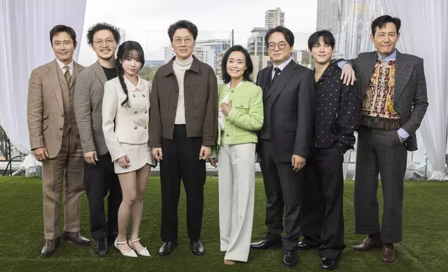 Lee Byung-hun, from left, Yang Dong-geun, Jo Yu-ri, Hwang Dong-hyuk, Kang Ae-sim, Lee Seo-hwan, Im Si-wan and Lee Jung-jae pose for a portrait to promote the second season of "Squid Game" on Wednesday, Dec. 11, 2024, in Los Angeles. (Photo by Willy Sanjuan/Invision/AP)