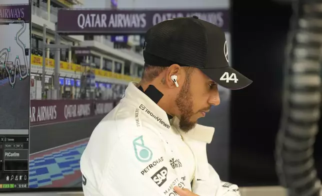 Mercedes driver Lewis Hamilton of Britain prepares prior to the start of the sprint race at the Formula One Qatar Grand Prix, at the Lusail International Circuit in Lusail, Qatar, Saturday, Nov. 30, 2024. (AP Photo/Darko Bandic)