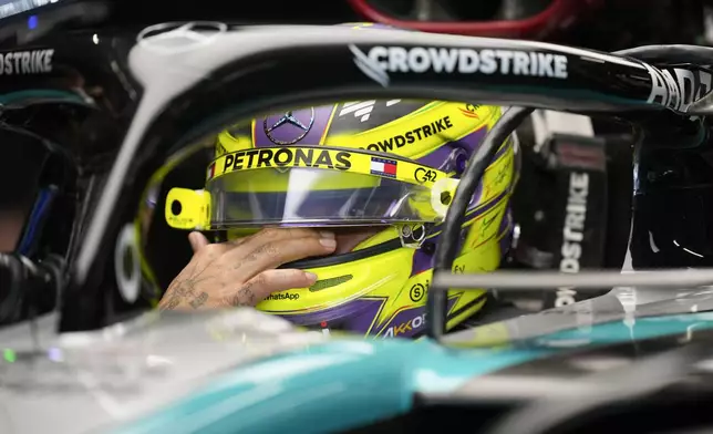 Mercedes driver Lewis Hamilton of Britain gets ready for practice at the Lusail International Circuit in Lusail, Qatar, ahead of the Qatar Formula One Grand Prix, Friday, Nov. 29, 2024. (AP Photo/Darko Bandic)