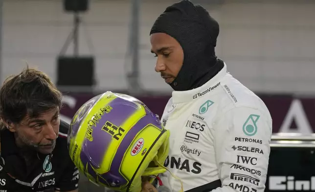 Mercedes driver Lewis Hamilton of Britain prepares prior to the start of the sprint race at the Formula One Qatar Grand Prix, at the Lusail International Circuit in Lusail, Qatar, Saturday, Nov. 30, 2024. (AP Photo/Pool/ Altaf Qadri)